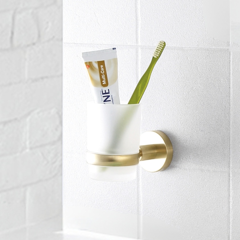 Close up product lifestyle image of the JTP Vos Brushed Brass Tumbler Holder